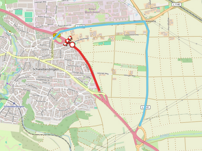 Eine Landkarte zeigt Schwieberdingen und die umliegenden Straßen. Der Verlauf einer Straße ist rot markiert, während alternative Routen in blau und gelb angezeigt werden. Das Bild dient zur Orientierung in der Umgebung.