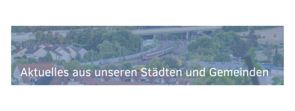 A scenic view of a town with houses, greenery, and a railway line. The text overlay in German reads, "Updates from our cities and communities."