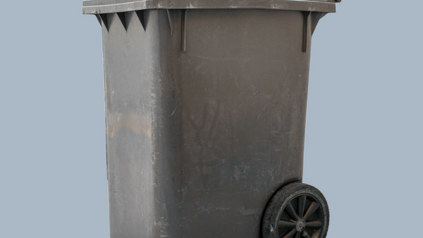 Ein brauner Abfalleimer steht auf blauem Hintergrund.